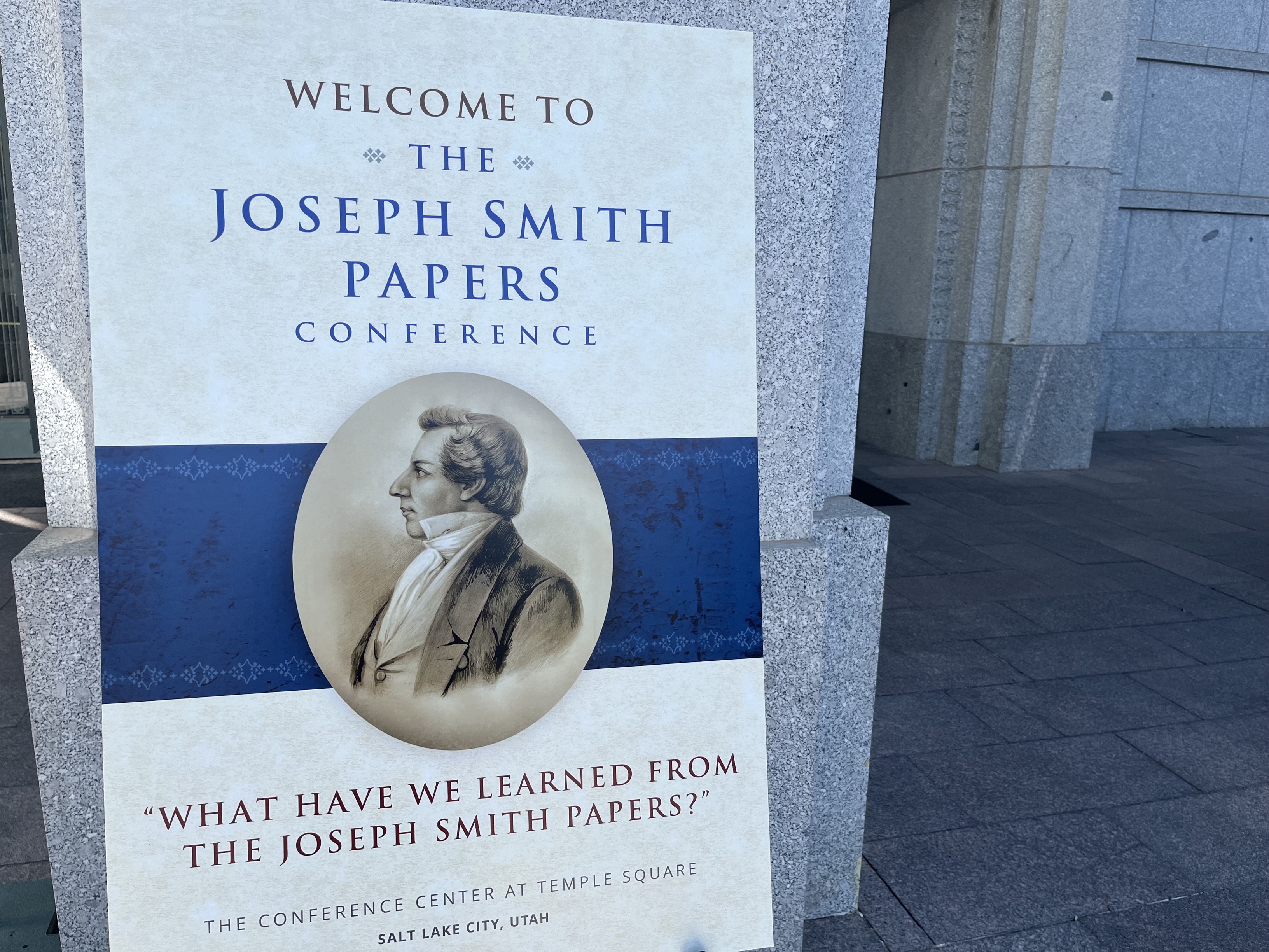 Welcome poster for the Joseph Smith Papers conference outside the Conference Center